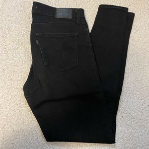 BLACK LEVI’S 702 JEANS